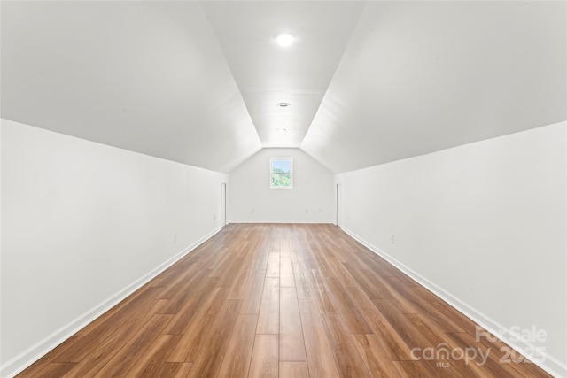 18733 Bluff Point Rd, Cornelius, NC 28031 - bonus room with lofted ceiling and light wood finished floors