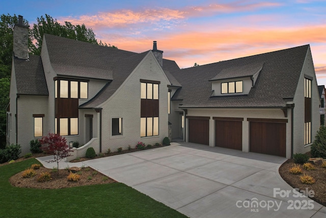 213 Crest Ct, Weddington, NC 28104 - view of front of house featuring a chimney, driveway, and a shingled roof
