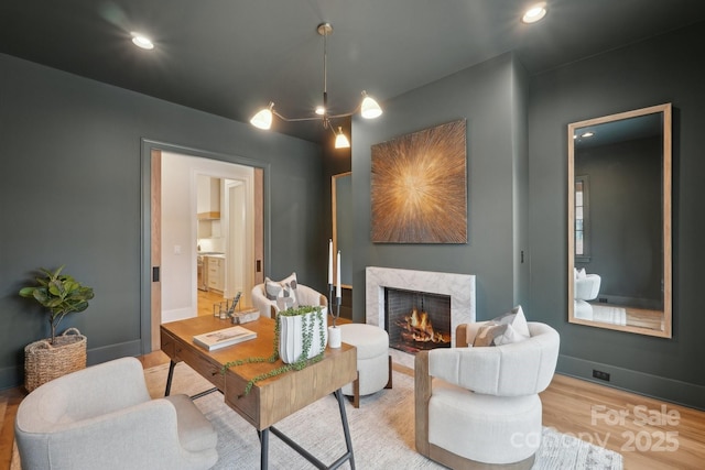 213 Crest Ct, Weddington, NC 28104 - office with wood finished floors, a premium fireplace, recessed lighting, and baseboards