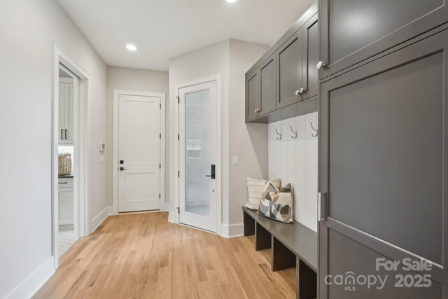 213 Crest Ct, Weddington, NC 28104 - mudroom with light wood finished floors, baseboards, and recessed lighting