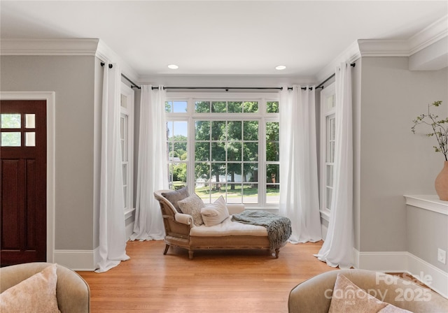 901 Hartford Ave, Charlotte, NC 28209 - living area with baseboards, light wood-style flooring, crown molding, and recessed lighting