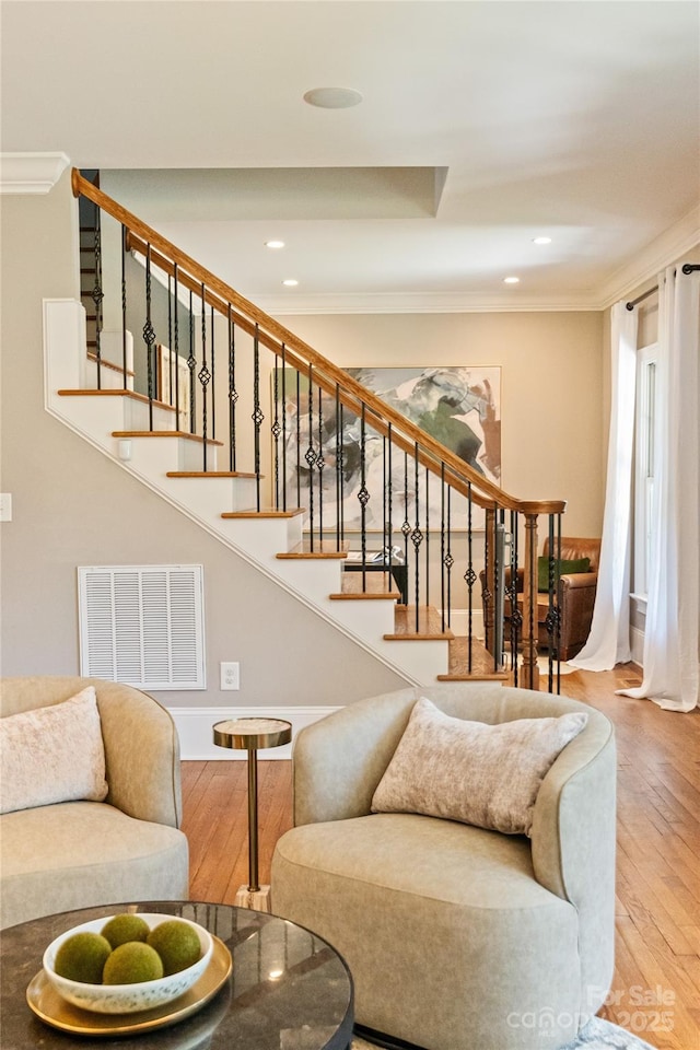 901 Hartford Ave, Charlotte, NC 28209 - living area featuring wood finished floors, ornamental molding, recessed lighting, and stairway