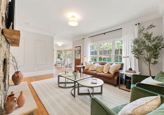 901 Hartford Ave, Charlotte, NC 28209 - living area featuring plenty of natural light, light wood-style floors, ornamental molding, and baseboards