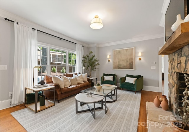 901 Hartford Ave, Charlotte, NC 28209 - living room featuring wood finished floors, ornamental molding, baseboards, and a fireplace