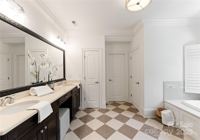 901 Hartford Ave, Charlotte, NC 28209 - full bath with double vanity, ornamental molding, a bath, tile patterned floors, and baseboards