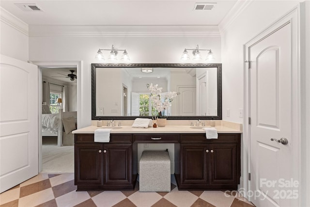 901 Hartford Ave, Charlotte, NC 28209 - ensuite bathroom with tile patterned floors, ornamental molding, double vanity, and plenty of natural light