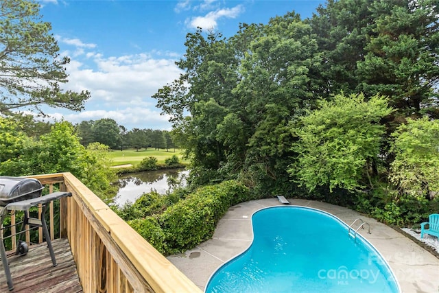 7704 Ninth Fairway Ln, Mint Hill, NC 28227 - outdoor pool featuring view of scattered trees, area for grilling, a water view, and a diving board