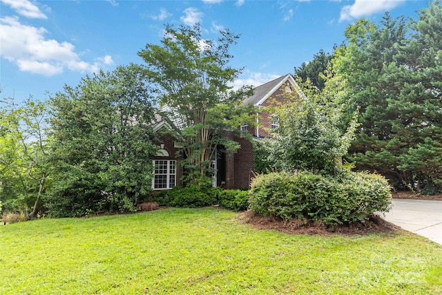 7704 Ninth Fairway Ln, Mint Hill, NC 28227 - obstructed view of property with a front lawn and brick siding