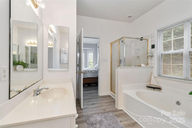 7704 Ninth Fairway Ln, Mint Hill, NC 28227 - ensuite bathroom with a stall shower, a bath, vanity, and wood finished floors