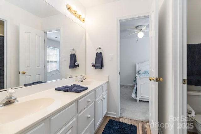 7704 Ninth Fairway Ln, Mint Hill, NC 28227 - bathroom featuring connected bathroom, double vanity, wood finished floors, and ceiling fan