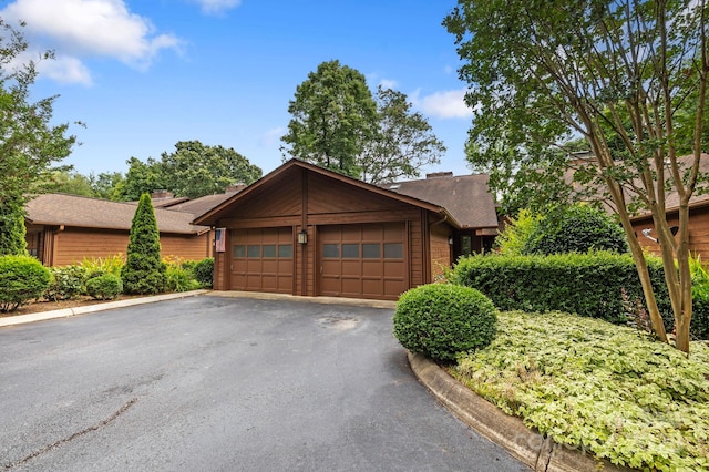 204 Woodfield Dr, Asheville, NC 28803 - view of front of property with a garage and asphalt driveway