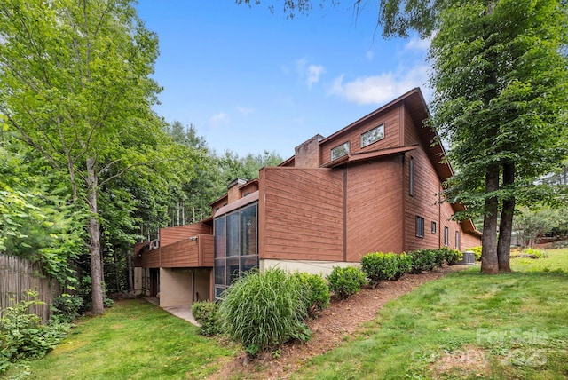 204 Woodfield Dr, Asheville, NC 28803 - view of home's exterior featuring a sunroom and a central air condition unit