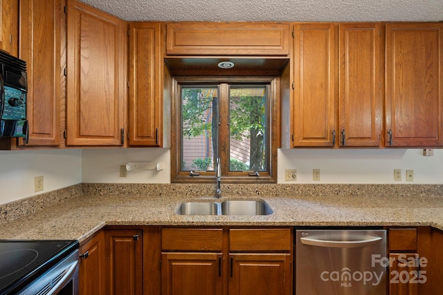 204 Woodfield Dr, Asheville, NC 28803 - kitchen with dishwasher, brown cabinetry, and light stone counters