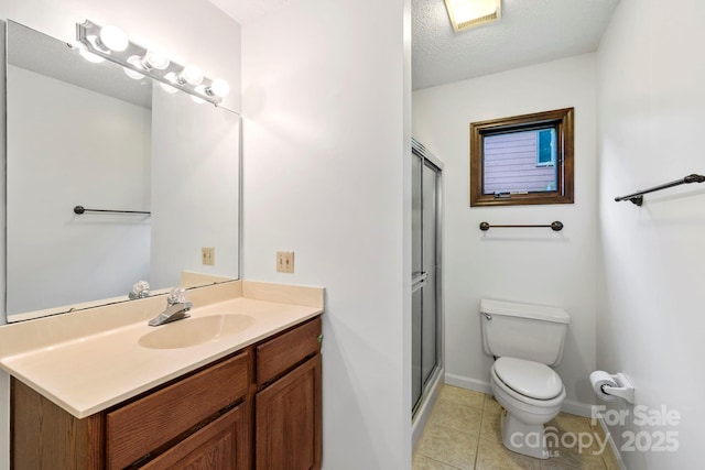 204 Woodfield Dr, Asheville, NC 28803 - full bathroom with vanity, a shower stall, tile patterned flooring, and a textured ceiling