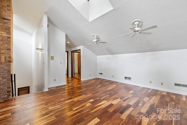 204 Woodfield Dr, Asheville, NC 28803 - additional living space with lofted ceiling, wood finished floors, a textured ceiling, ceiling fan, and a skylight