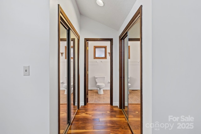 204 Woodfield Dr, Asheville, NC 28803 - hall with hardwood / wood-style floors and vaulted ceiling