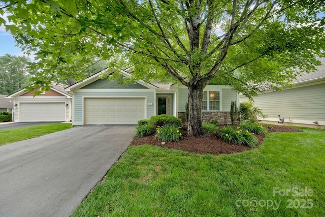 145 Fairway View Dr, Etowah, NC 28729 - view of front of home with asphalt driveway, a front yard, and a garage