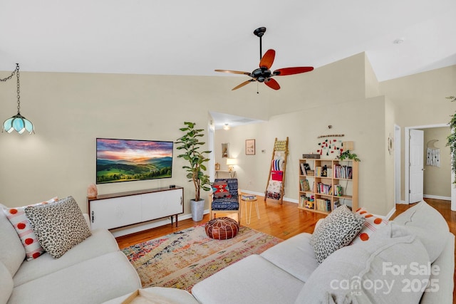 145 Fairway View Dr, Etowah, NC 28729 - living area with a ceiling fan, wood finished floors, and baseboards