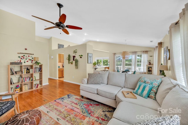 145 Fairway View Dr, Etowah, NC 28729 - living room with a ceiling fan, wood finished floors, vaulted ceiling, baseboards, and recessed lighting