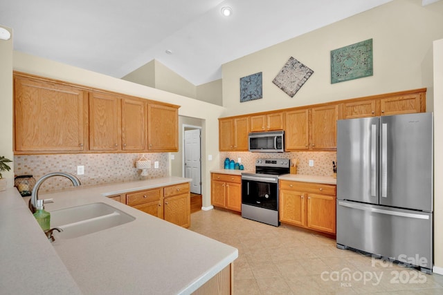 145 Fairway View Dr, Etowah, NC 28729 - kitchen featuring appliances with stainless steel finishes, a sink, light countertops, backsplash, and high vaulted ceiling