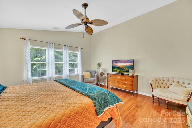 145 Fairway View Dr, Etowah, NC 28729 - bedroom with vaulted ceiling, wood finished floors, baseboards, and a ceiling fan