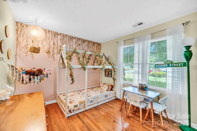 145 Fairway View Dr, Etowah, NC 28729 - bedroom featuring wood finished floors and baseboards