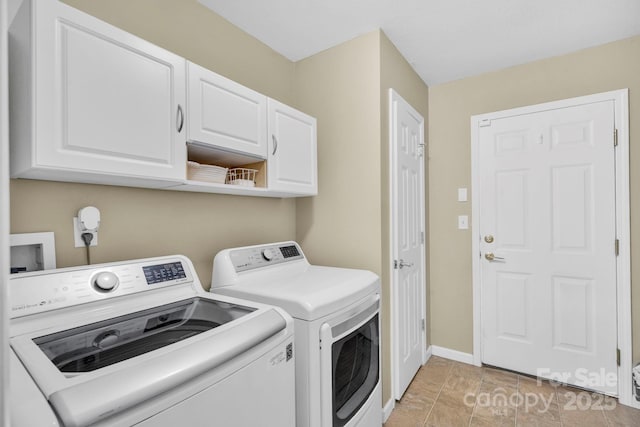 145 Fairway View Dr, Etowah, NC 28729 - laundry room featuring washer and dryer, cabinet space, and baseboards