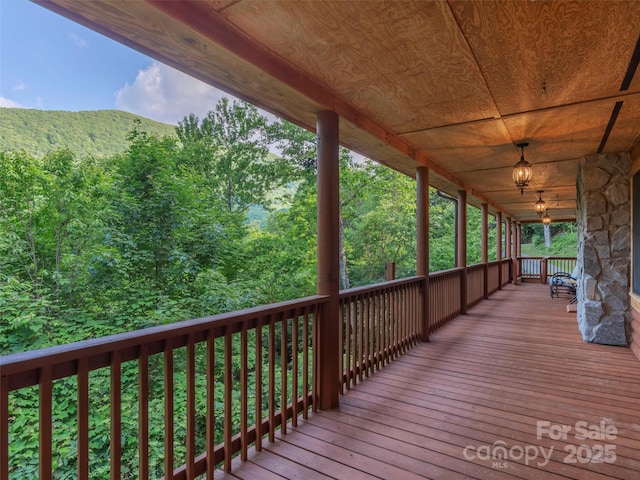 47 Tammy Dr, Maggie Valley, NC 28751 - wooden porch with a wooded view
