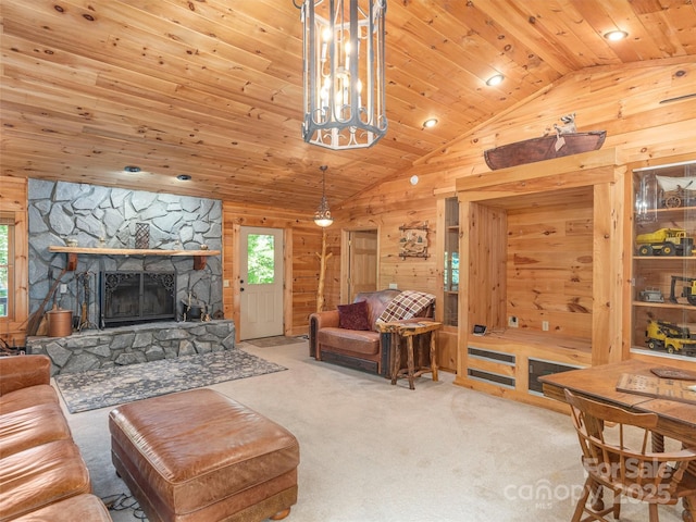 47 Tammy Dr, Maggie Valley, NC 28751 - carpeted living area featuring lofted ceiling, wooden walls, wooden ceiling, and a fireplace