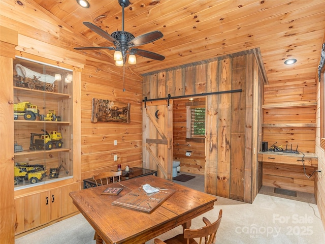 47 Tammy Dr, Maggie Valley, NC 28751 - dining area featuring wooden ceiling, lofted ceiling, a barn door, carpet floors, and wooden walls