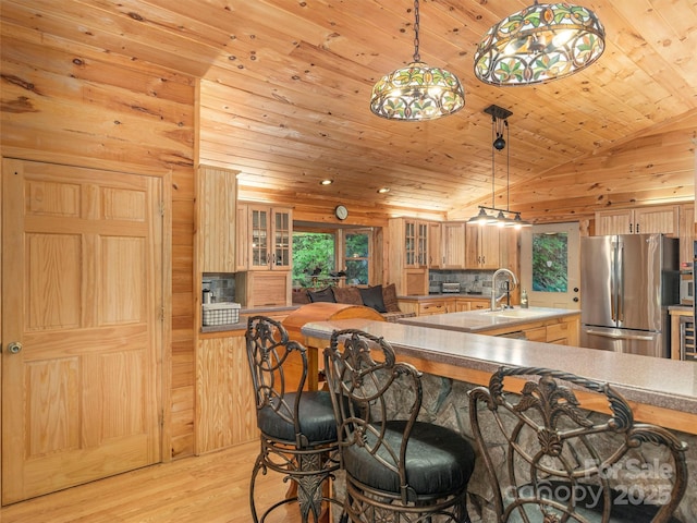 47 Tammy Dr, Maggie Valley, NC 28751 - kitchen featuring freestanding refrigerator, wooden ceiling, light wood finished floors, a spacious island, and glass insert cabinets