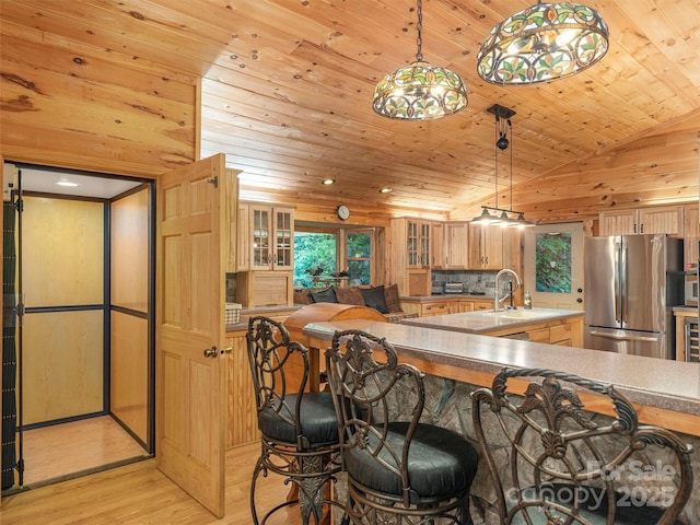 47 Tammy Dr, Maggie Valley, NC 28751 - kitchen featuring freestanding refrigerator, light wood finished floors, wooden ceiling, a sink, and plenty of natural light