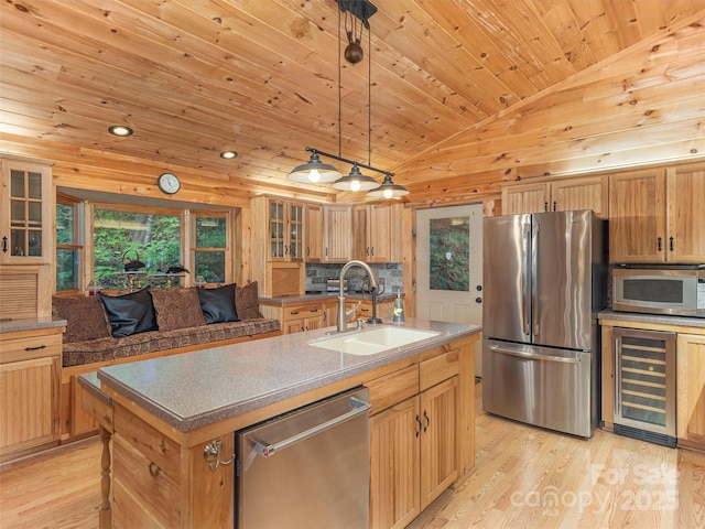 47 Tammy Dr, Maggie Valley, NC 28751 - kitchen featuring stainless steel appliances, beverage cooler, a sink, lofted ceiling, and light wood finished floors