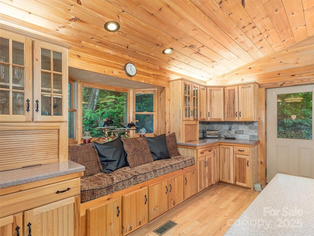 47 Tammy Dr, Maggie Valley, NC 28751 - kitchen with light wood-style floors, vaulted ceiling, wood ceiling, tasteful backsplash, and light brown cabinetry