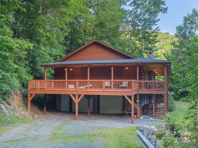 47 Tammy Dr, Maggie Valley, NC 28751 - cabin featuring log exterior, a chimney, driveway, stairs, and a deck