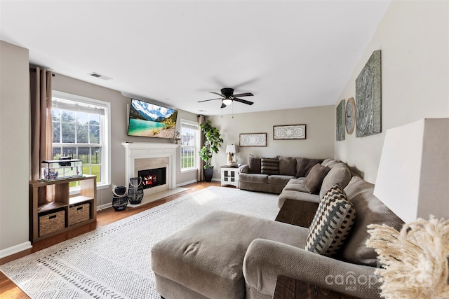 4612 Maple Crest Pl, Harrisburg, NC 28075 - living room with wood finished floors, ceiling fan, a high end fireplace, and baseboards