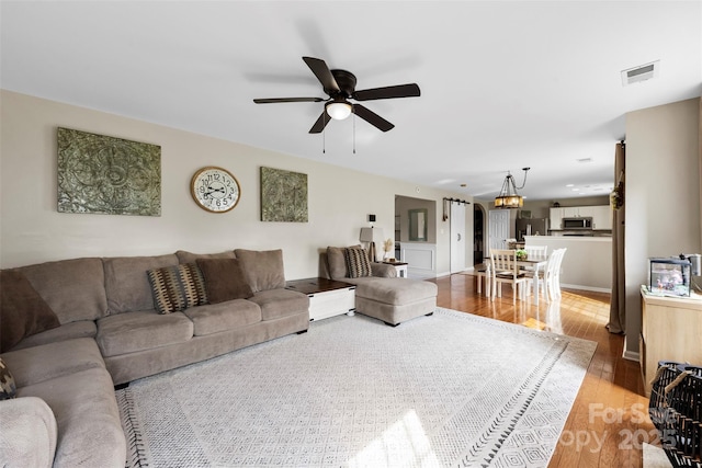 4612 Maple Crest Pl, Harrisburg, NC 28075 - living area with light wood finished floors and ceiling fan