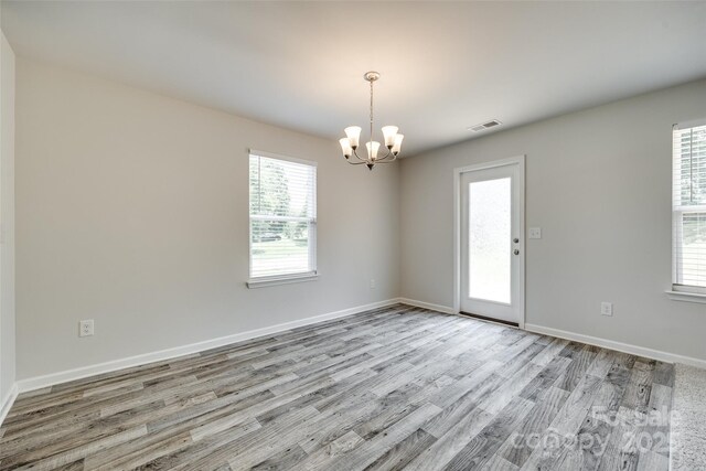 463 W Barr St, Lancaster, SC 29720 - unfurnished room with a chandelier, wood finished floors, and baseboards