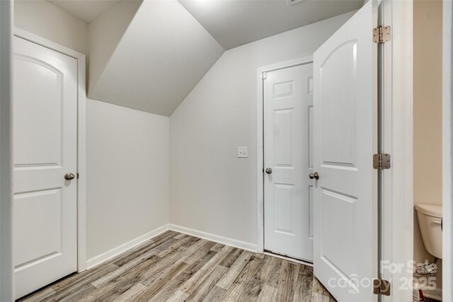 463 W Barr St, Lancaster, SC 29720 - additional living space with light wood-style floors, lofted ceiling, and baseboards