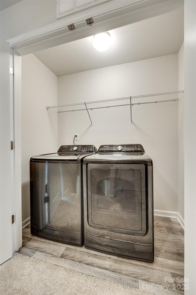 463 W Barr St, Lancaster, SC 29720 - washroom with independent washer and dryer, wood finished floors, and baseboards