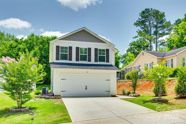 463 W Barr St, Lancaster, SC 29720 - view of front of home with central air condition unit, a front lawn, and driveway