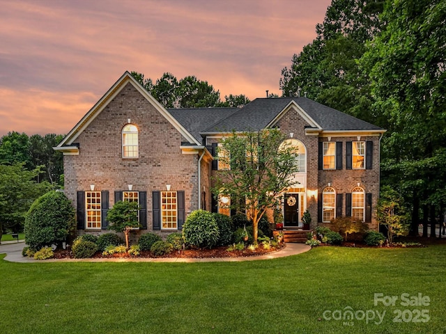 105 Beech Bluff Dr, Mount Holly, NC 28120 - colonial home featuring brick siding and a front lawn