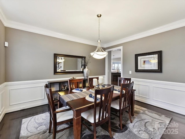 105 Beech Bluff Dr, Mount Holly, NC 28120 - dining area featuring dark wood-type flooring, ornamental molding, wainscoting, and a decorative wall