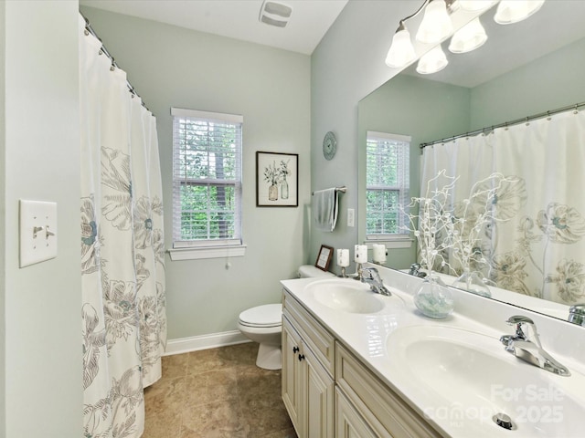 105 Beech Bluff Dr, Mount Holly, NC 28120 - bathroom with double vanity, curtained shower, and tile patterned floors