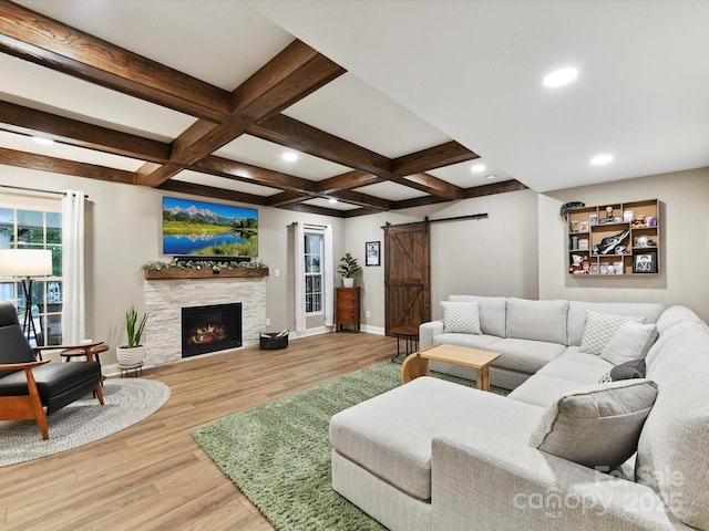 105 Beech Bluff Dr, Mount Holly, NC 28120 - living area featuring a barn door, wood finished floors, recessed lighting, beamed ceiling, and a lit fireplace