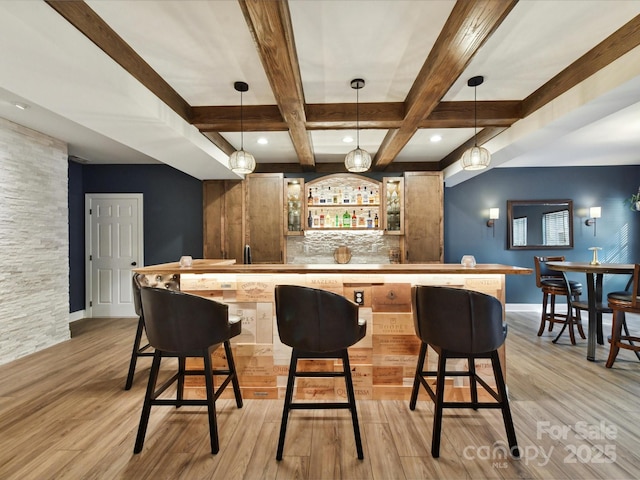105 Beech Bluff Dr, Mount Holly, NC 28120 - indoor wet bar featuring light wood-style flooring, beamed ceiling, coffered ceiling, hanging light fixtures, and decorative backsplash