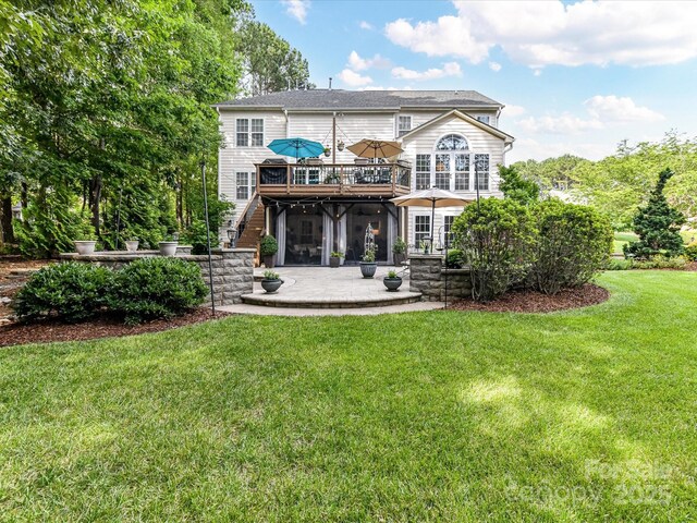 105 Beech Bluff Dr, Mount Holly, NC 28120 - back of property with a patio area, a wooden deck, stairs, and a lawn