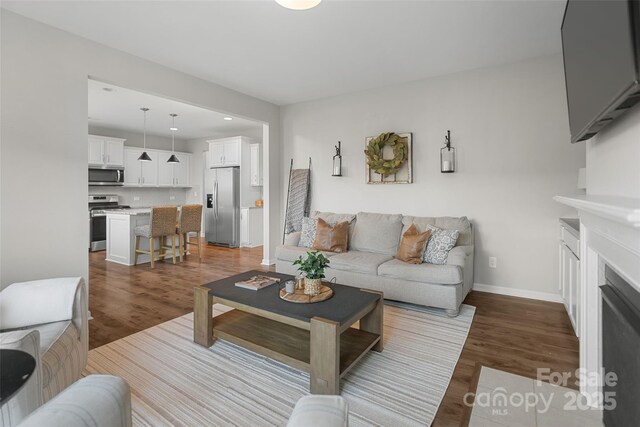 1826 Goodheart Ln, York, SC 29745 - living area featuring wood finished floors, a fireplace, baseboards, and recessed lighting