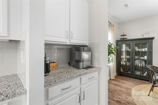 1826 Goodheart Ln, York, SC 29745 - bar featuring light wood-style flooring and tasteful backsplash
