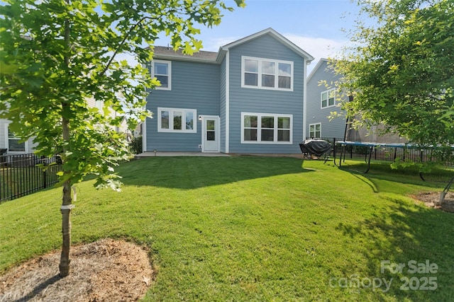 1826 Goodheart Ln, York, SC 29745 - rear view of house featuring a trampoline and a patio area